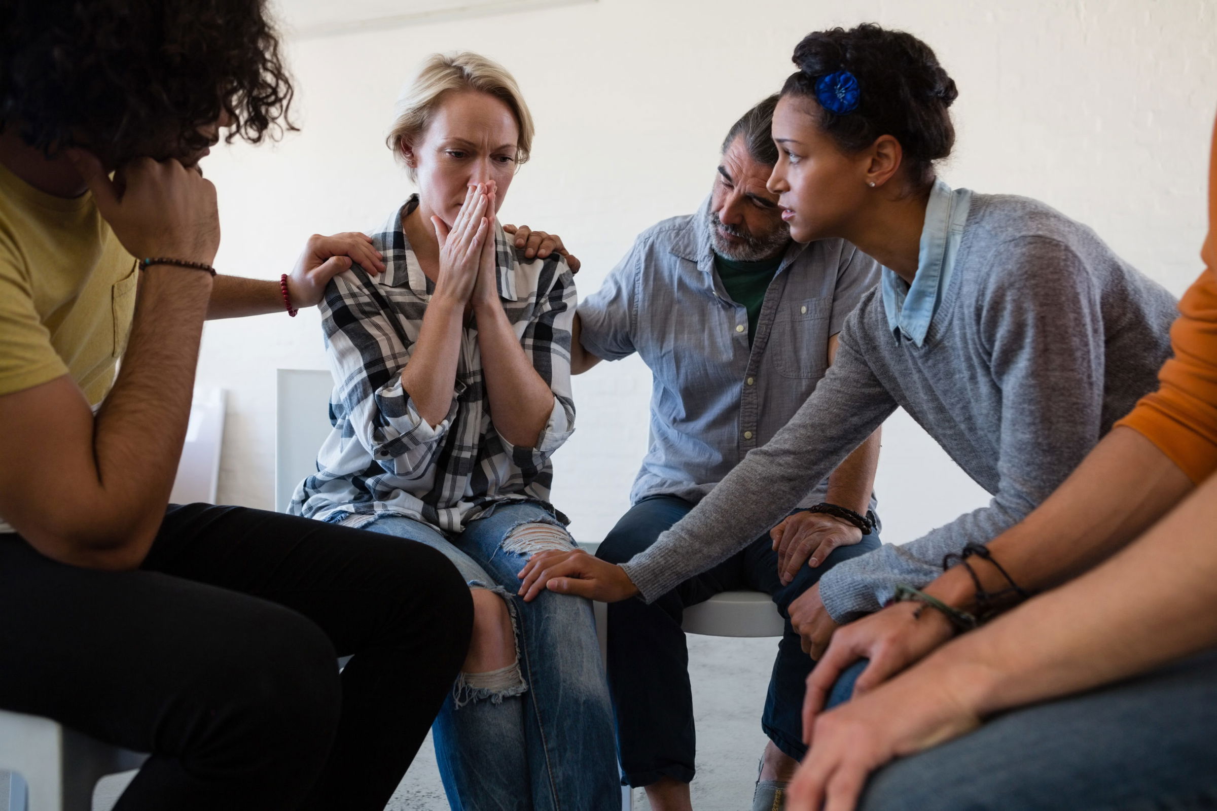 Woman being consoled after wrongful death of loved one