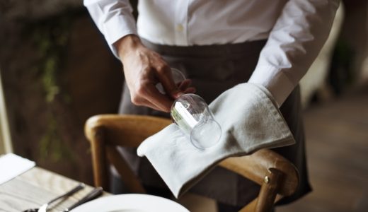 French Laundry Employee Alleges Wage Theft 3 A waiter polishing a glass at a California fine dining restaurant.