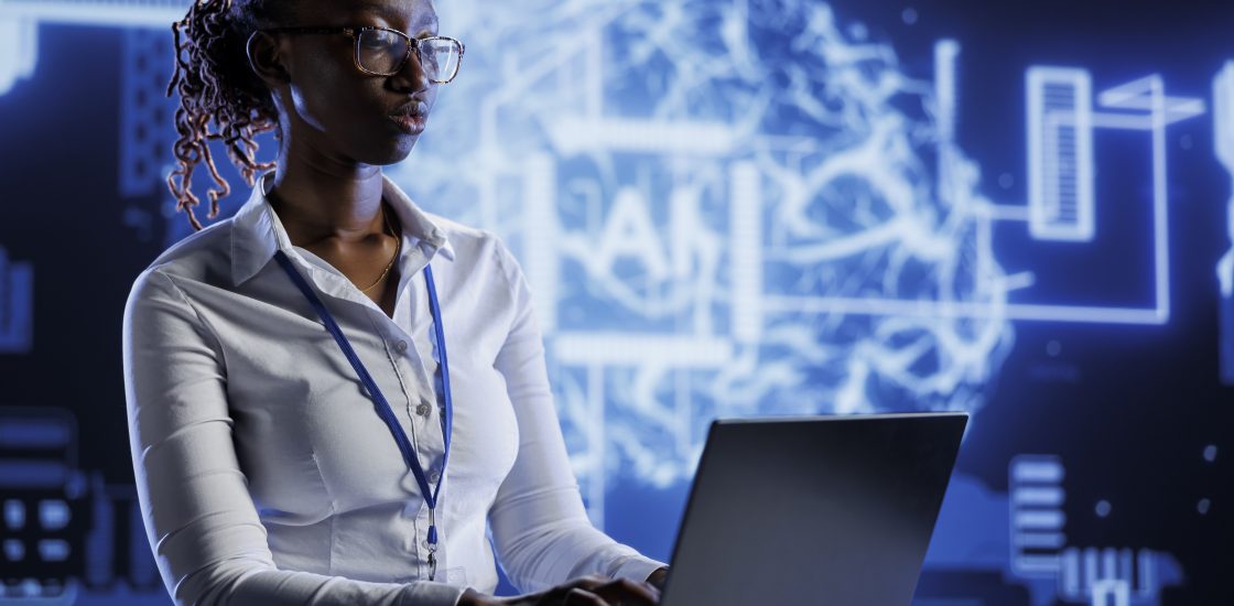 A Black woman working with AI in a San Francisco office.